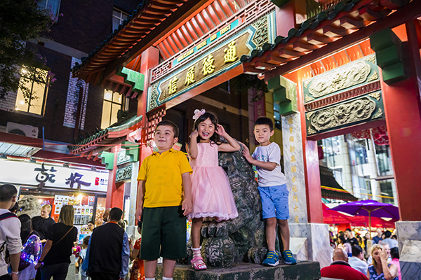 Children enjoying a night out at Chinatown Night Markets on Dixon street, Sydney.