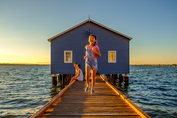 A family enjoying one of the most unique things to do in Perth - the Blue Boatshed