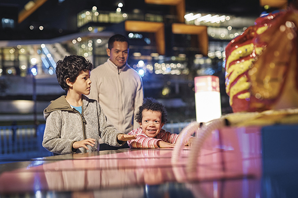 Children interacting with accessible installation 'In the Scale of the Sea' in Tumbalong Park, Darling Harbour during Vivid Sydney 2018