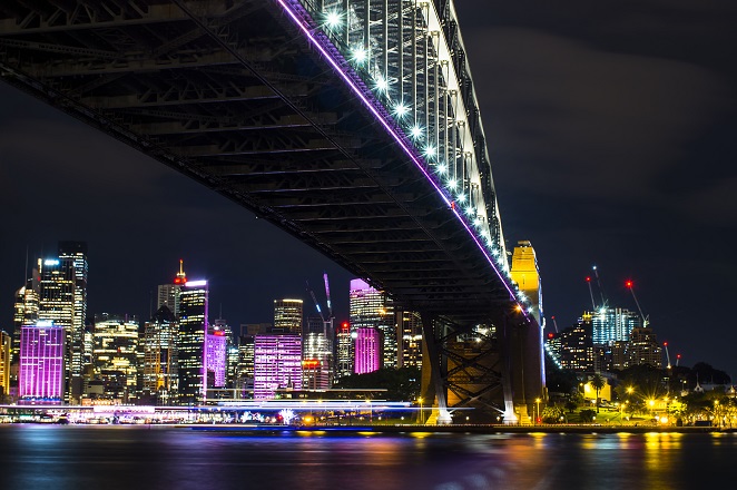 Sydney Harbour Bridge bathed in neon light